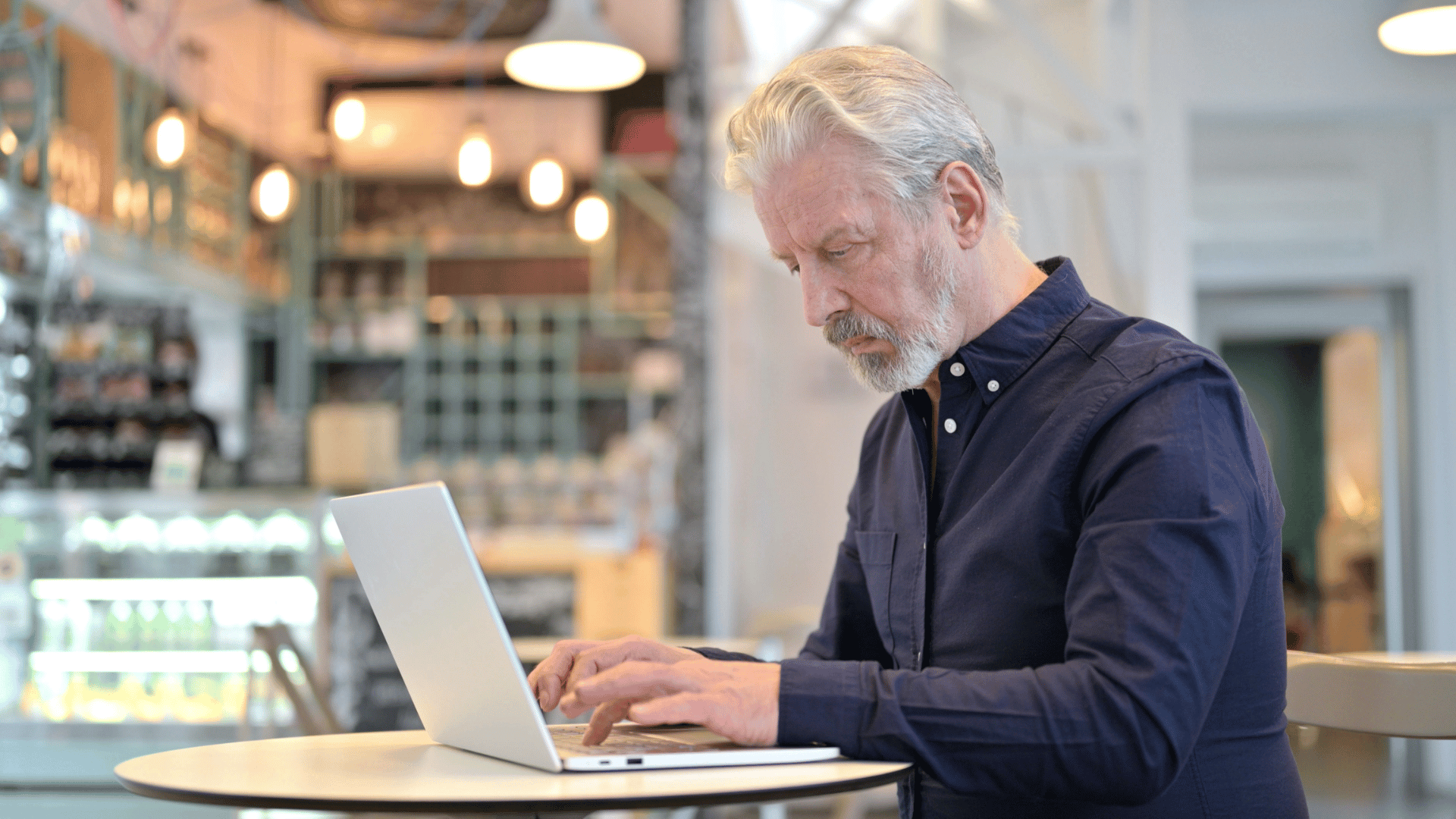 old man working on computer